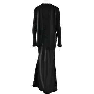 Detailed view of long black satin dress with matching shawl featuring sleek silhouette
