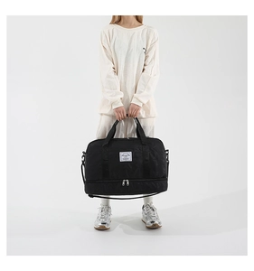Detail view of large fitness bag with independent shoe compartment and waterproof fabric