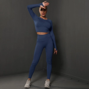 Detail of navy blue seamless yoga set showing thumb holes and high waist compression fabric