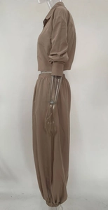 Detail view of the elastic waistband on brown cropped shirt and jogger set