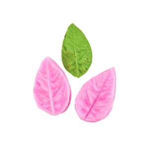 Macro view of pink leaf-shaped silicone fondant molds with realistic leaf texture detail