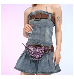 Y2K style purple leopard print mini underwear-shaped crossbody bag worn by a model