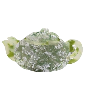 Acetate teapot hair claw clip with green and white marbling for elegant hair styling
