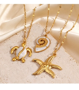 Detailed view of gold starfish sea turtle and nautilus shell pendants on flat link chains