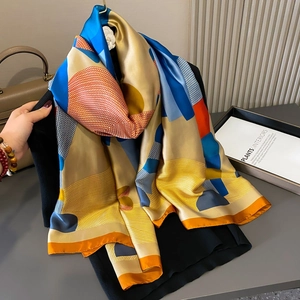 Satin silk scarf with horse print and geometric patterns in gold and blue colors