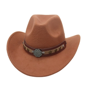 Detail of caramel felt cowboy hat with leather band and vintage floral metal buckle