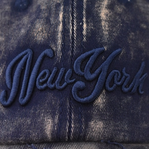 Washed navy blue denim baseball cap with 3D New York embroidery and vintage distressed finish