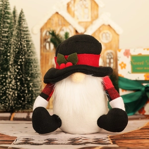Nordic Christmas gnome plush with red black plaid arms and holly leaf hat on festive background