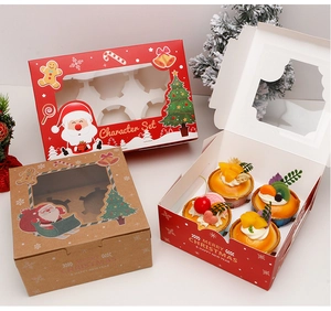 Detailed view of Christmas cupcake boxes with clear windows and festive holiday designs