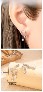 Detail of silver heart earrings with micro-zirconia and a star pendant with dimensions