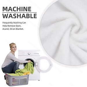 Detail of soft white flannel blanket showing machine washable fabric and fine texture