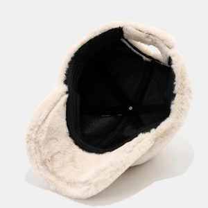 Soft cream-colored plush baseball cap with warm inner lining shown from an inside angle