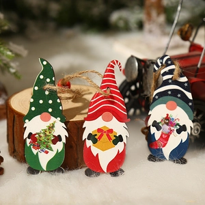 Set of three colorful wooden forest dwarf Christmas ornaments with natural hanging ropes