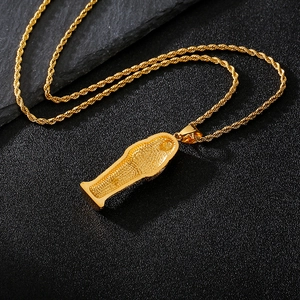 Detailed close-up of 18K gold Eye of Horus pharaoh sarcophagus pendant on a rope chain