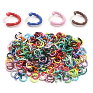Detailed macro shot of colorful painted DIY jump rings for jewelry making and connections