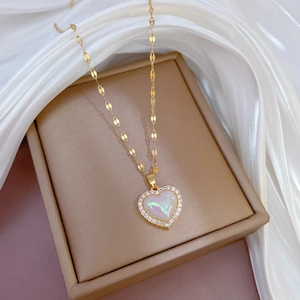 Golden heart necklace with iridescent gemstone and micro-pave cubic zirconia on silk