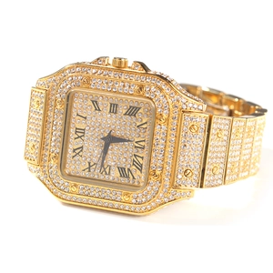 Detailed macro view of gold square watch face with Roman numerals and iced-out diamonds