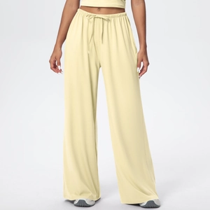Close-up of wide-leg sweatpants showing drawstring waist and draped brushed fabric texture