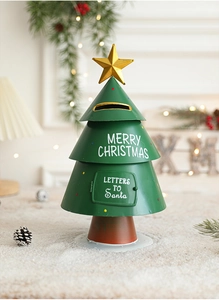 Close-up of green metal Christmas tree mailbox with Santa letters text in festive scene
