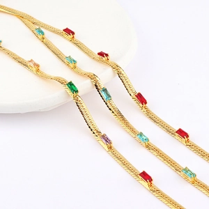 Detail of 18k gold plated snake chain necklace with colorful zircon rhinestone inlay