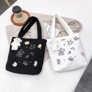 Chic plush faux fur tote bags with cute cartoon embroidery in black and white colors