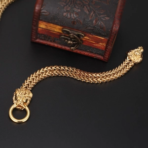 Men's gold stainless steel bracelet featuring dual lion head carvings and thick woven chain