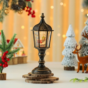 Detailed view of a vintage bronze Christmas water lantern with nativity scene and glitter