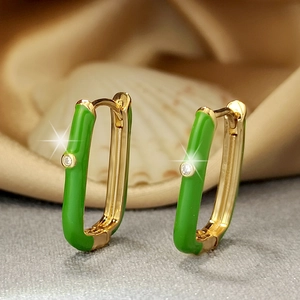 U-shaped gold-plated huggie earrings with green enamel and sparkling zircon center