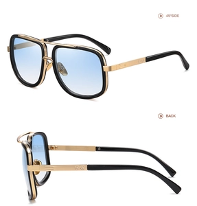 Detail view showing metal bridge and blue gradient lenses of square oversized sunglasses