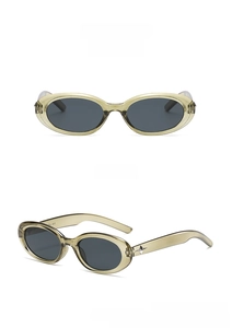 Detail view of oval translucent green frames with star metal accents and dark gray lenses