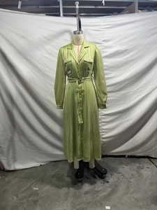 Close-up of green shimmering pinstripe dress showing shirt collar and utility pockets