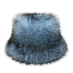 Detail view of the soft faux fox fur texture on the blue black gradient bucket hat