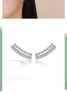 Detail of s925 sterling silver geometric stud earrings with inlaid zirconia and polished finish