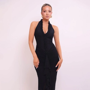 Detail of sexy black halter neck maxi dress featuring ruffle trim and ruched stretch fabric