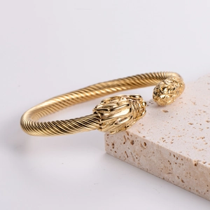18k gold plated stainless steel open cable bracelet with dual dragon head design