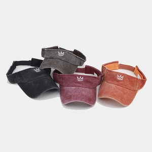 Detail view of washed cotton sun visors with crown embroidery in four different colors