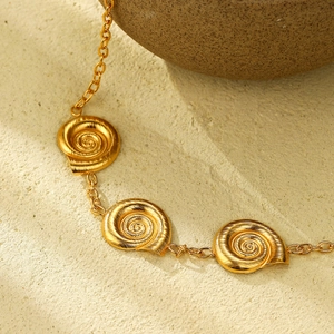 18k gold plated stainless steel necklace featuring textured spiral snail shell pendants