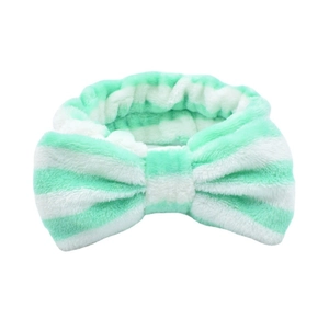 Striped mint green and white coral fleece headband with a large bow for washing face