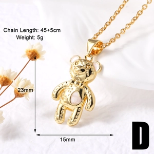 Macro view of gold teddy bear pendant with pink heart enamel detail and sizing dimensions
