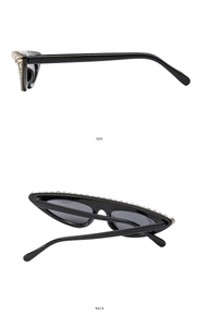 Detail view of black cat-eye sunglasses with side and back rhinestone embellishments