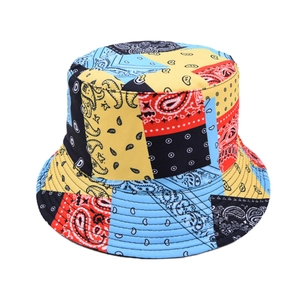 Detailed view of colorful paisley patchwork patterns and stitching on a canvas bucket hat