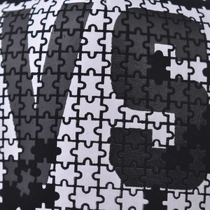 Black and white jigsaw puzzle mesh cap featuring bold V9 printed graphic for men