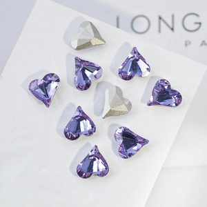Macro detail of lavender and silver heart-shaped K9 crystals with multifaceted cut