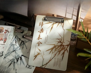 Detailed view of acrylic clipboard with traditional ink bamboo and calligraphy patterns