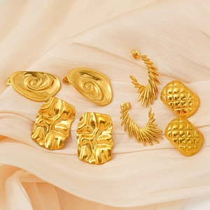 Set of 4 pairs of irregular gold titanium steel earrings with unique textures and patterns