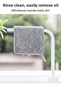 Thick grey bamboo charcoal fiber cleaning cloth hanging on a white rack for kitchen drying