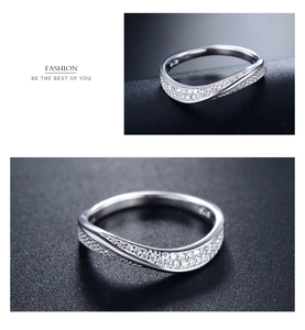 Detail of S925 sterling silver ring featuring micro-paved cubic zirconia in a curved design