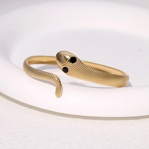 Elegant gold snake bracelet in stainless steel with detailed scales and an open design
