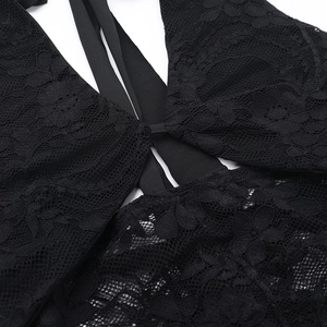 Close-up of intricate black lace hollow stitching and strap details on a bodycon dress