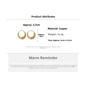 Detail view of gold-plated twisted C-shape earrings with size and material specifications